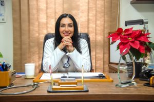 doctor who is a specialist sitting at their desk