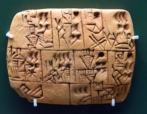 Clay cuneiform tablet from the late Uruk period, 3000-3100 BCE, in Mesopotamia, showing daily rations of barley beer issued to workers.