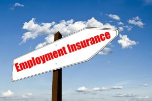 Sign post in the shape of an arrow, modified to read "Employment Insurance"