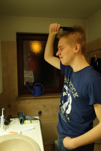 a man is combing his hair