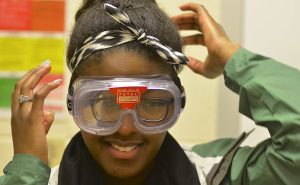 health care worker wearing goggles with glasses under them