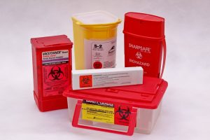 Image of various types of sharps containers