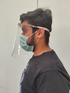 health care working with a face shield