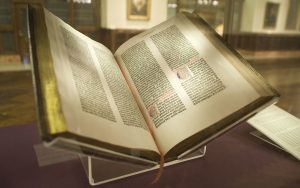 The Gutenberg bible propped open on a clear book holder