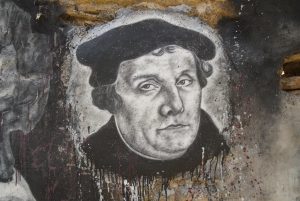 Spray painted image of Martin Luther on a concrete wall