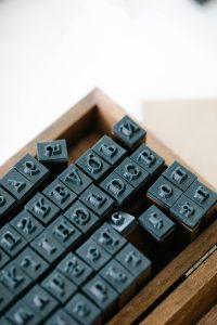 Metal letter blocks for a vintage printing press.