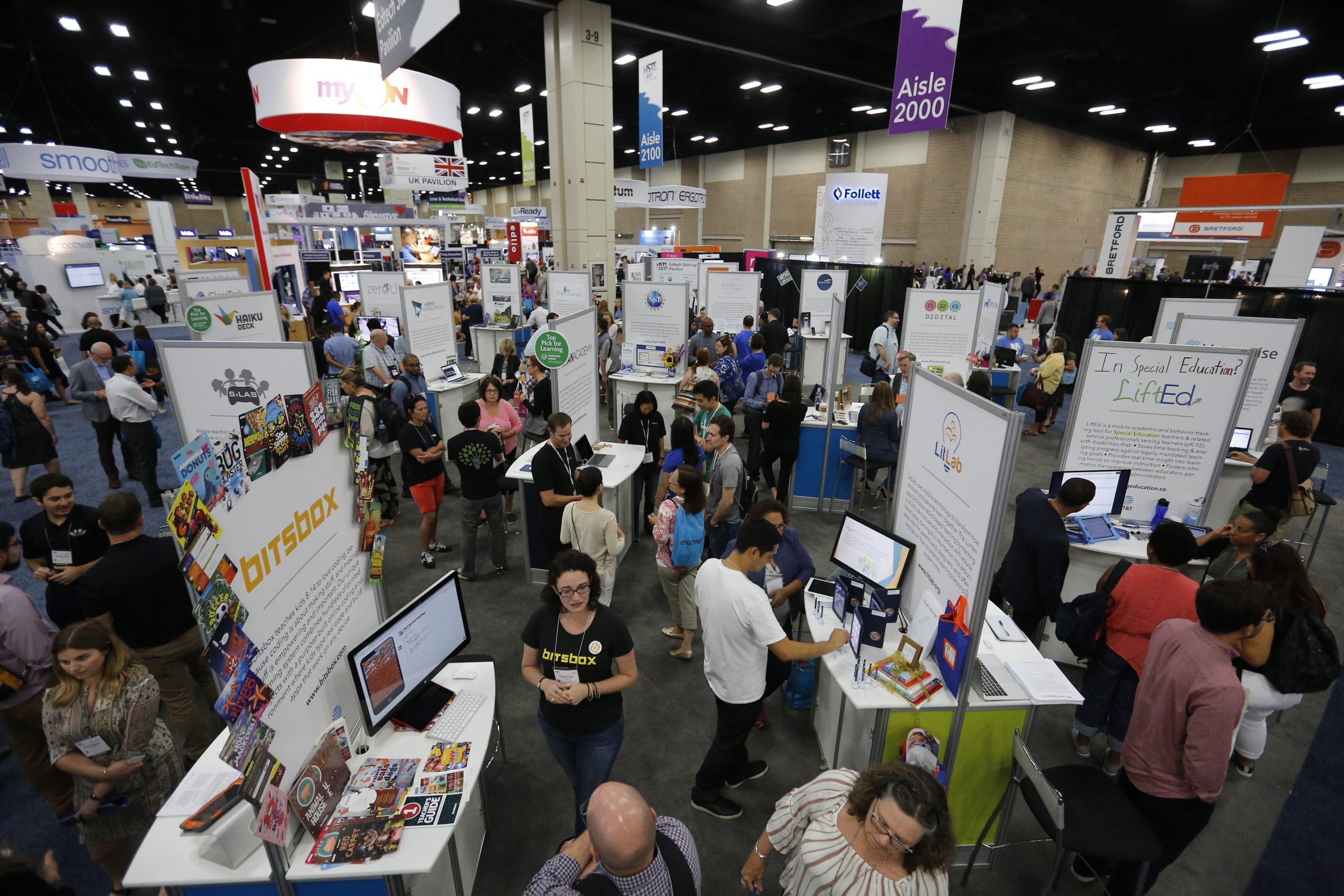 Participants and vendors walking around the displays at the ISTE startup trade show.